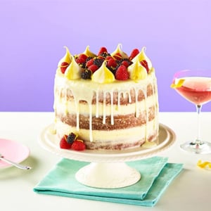 Three layer cake with fruit and icing