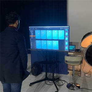 Aron in studio looking at a screen