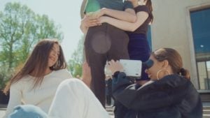 one girl filming another girl 