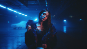 girl in a blue lit room 