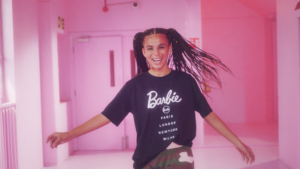 girl in pink room with barbie t shirt