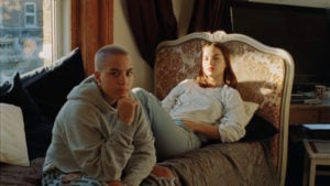 guy and girl looking at the camera